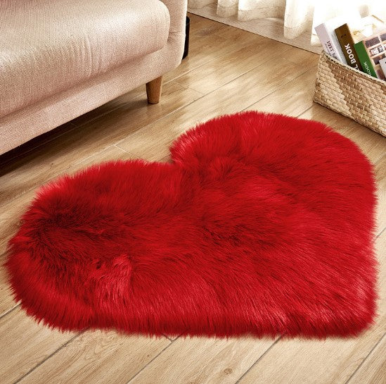 Plush heart shaped rug in red