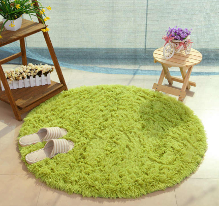 Green fluffy round shag rug