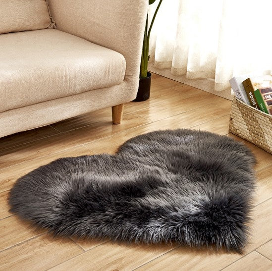 Plush heart shaped rug in dark grey