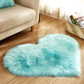 Plush heart shaped rug in blue