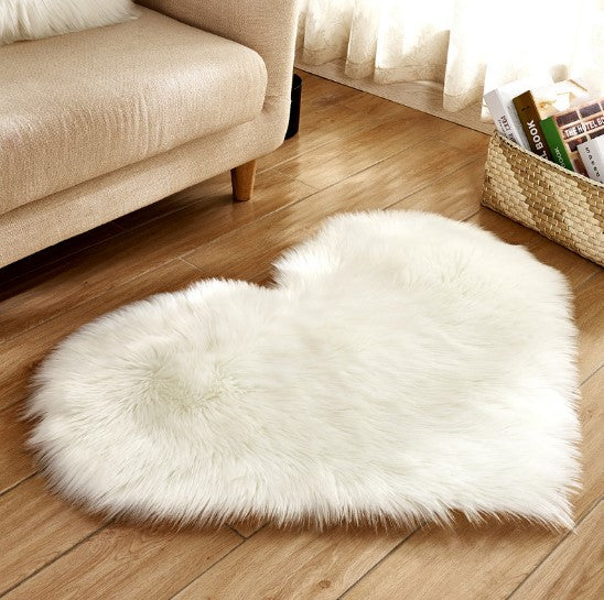 Plush heart shaped rug in white