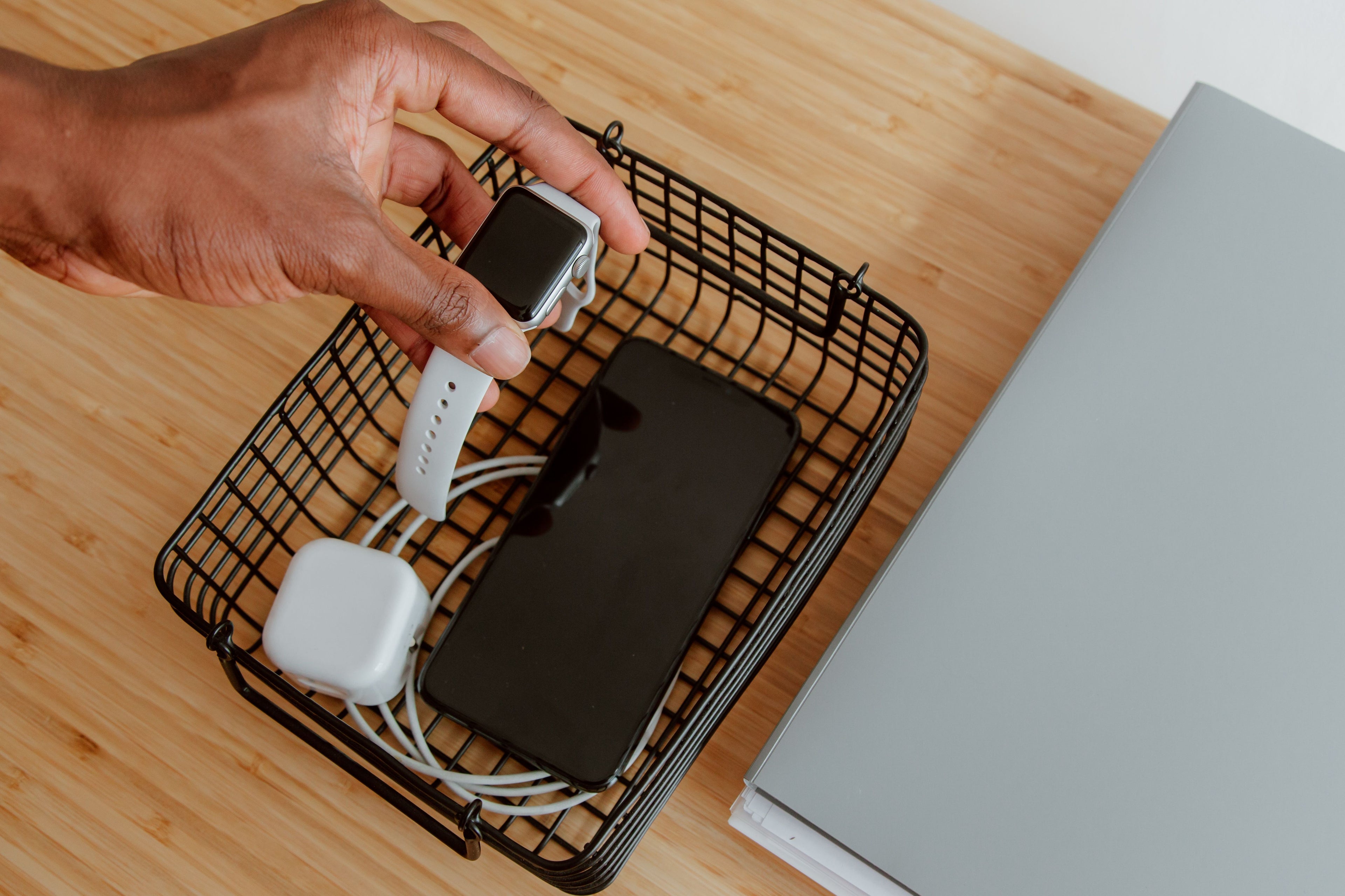 Smartwatch and phone on a wireless charging station