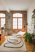 Soft neutral area rug in a living room